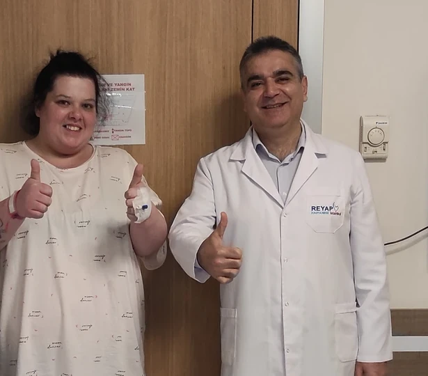 International patient with her surgeon after bariatric surgery
